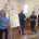 A group of trustees standing around a white board.